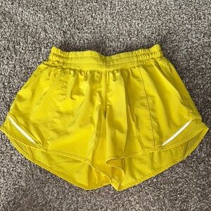 Yellow Women's Lululemon running shorts.